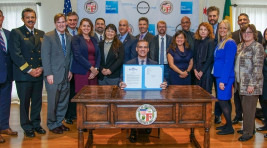 Mayor Eric Garcetti surrounded by City managers and representatives