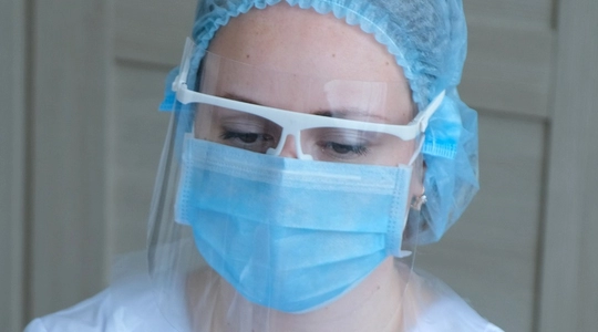 woman wearing protective face shield