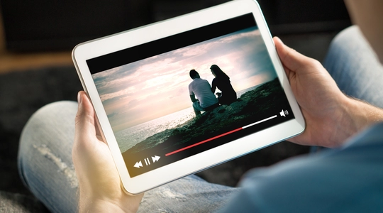 Person Watching Video on a Tablet