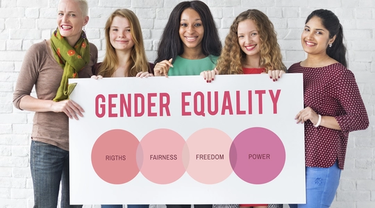 Women holding gender equality sign