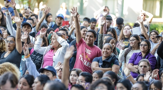 Group of People with their Hands Up