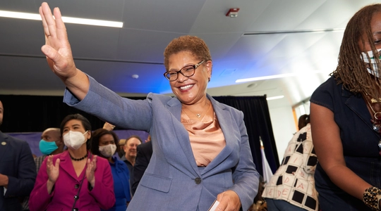 Image of Karen Bass waving