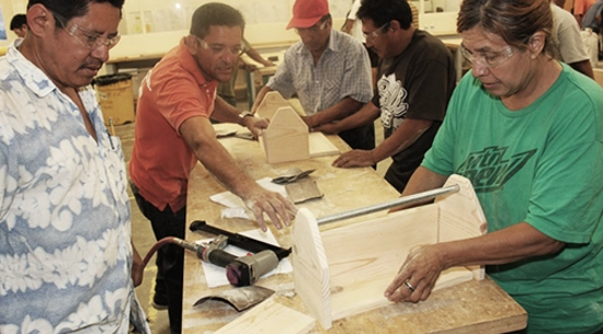 Day Laborers working in workshop