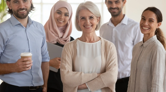 An elderly woman with a group of work colleagues