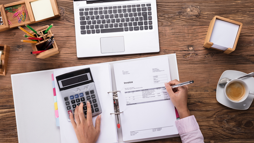 Picture of person working with an Invoice