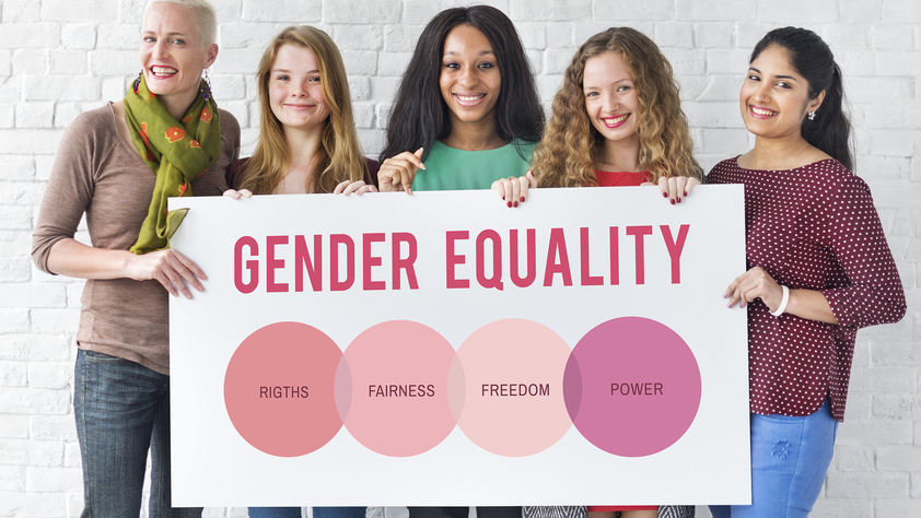 Women holding gender equality sign