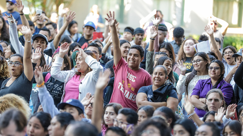 Group of People with their Hands Up